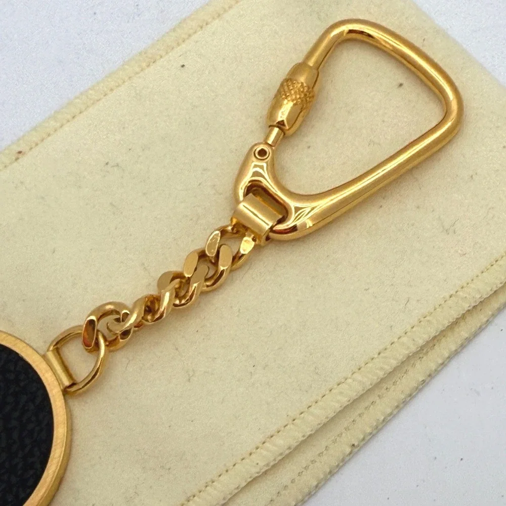 Dunhill Made in Italy Gold-Tone & Black Textured Leather Oval Keychain Key Fob‎